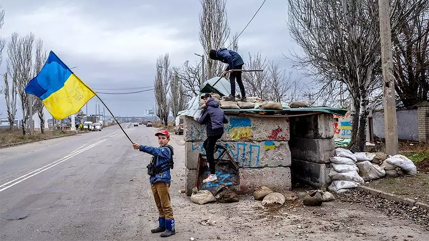 children play at an abandoned checkpoint